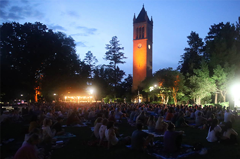 Students worshipping in front of Iowa State Campanile